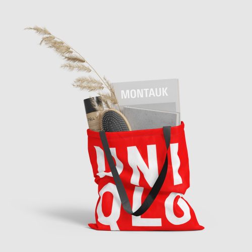 Image of a red Uniqlo tote on a grayscale background